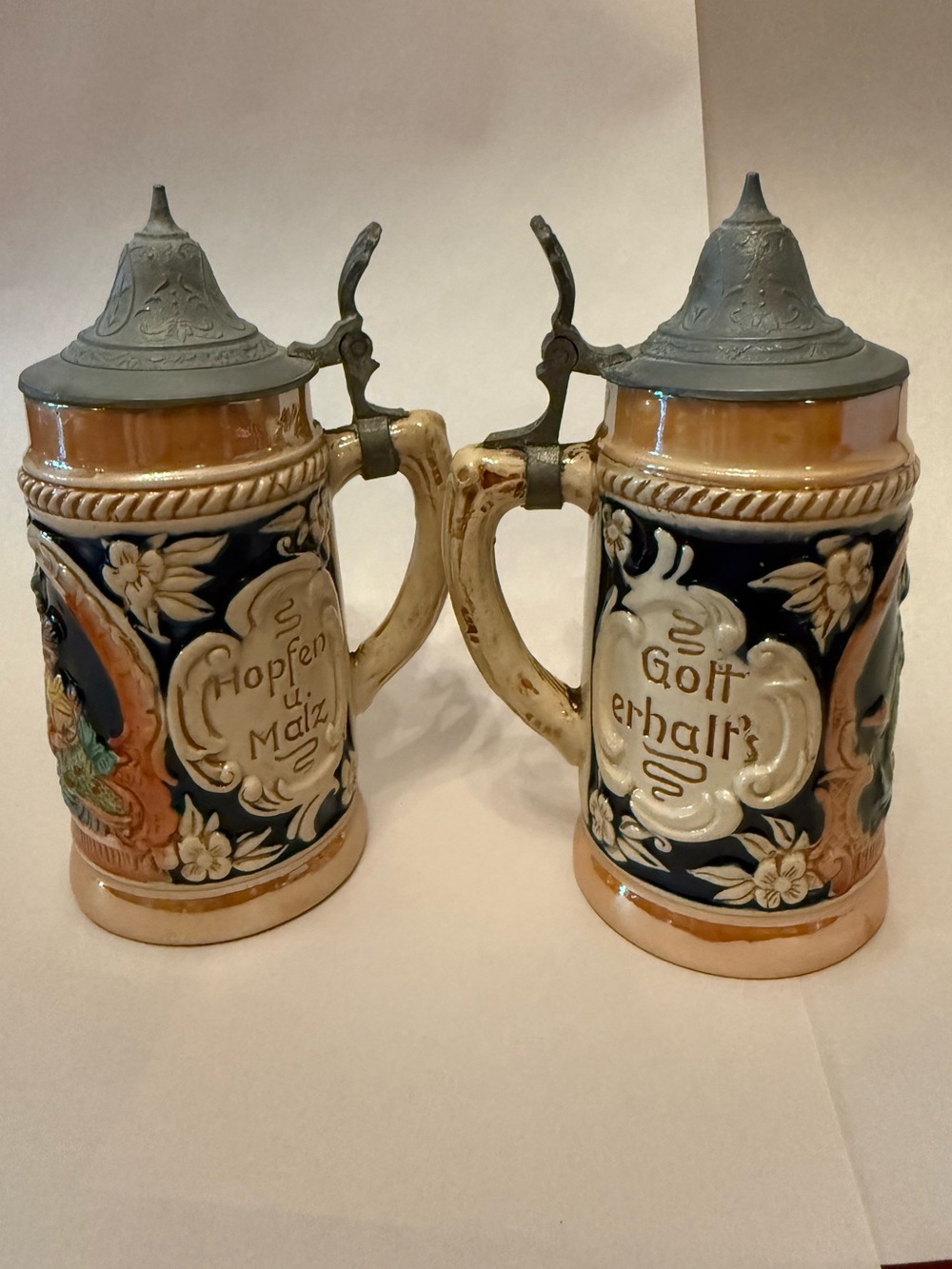 Pair of Vintage German Ceramic Beer Steins with Pewter Lids